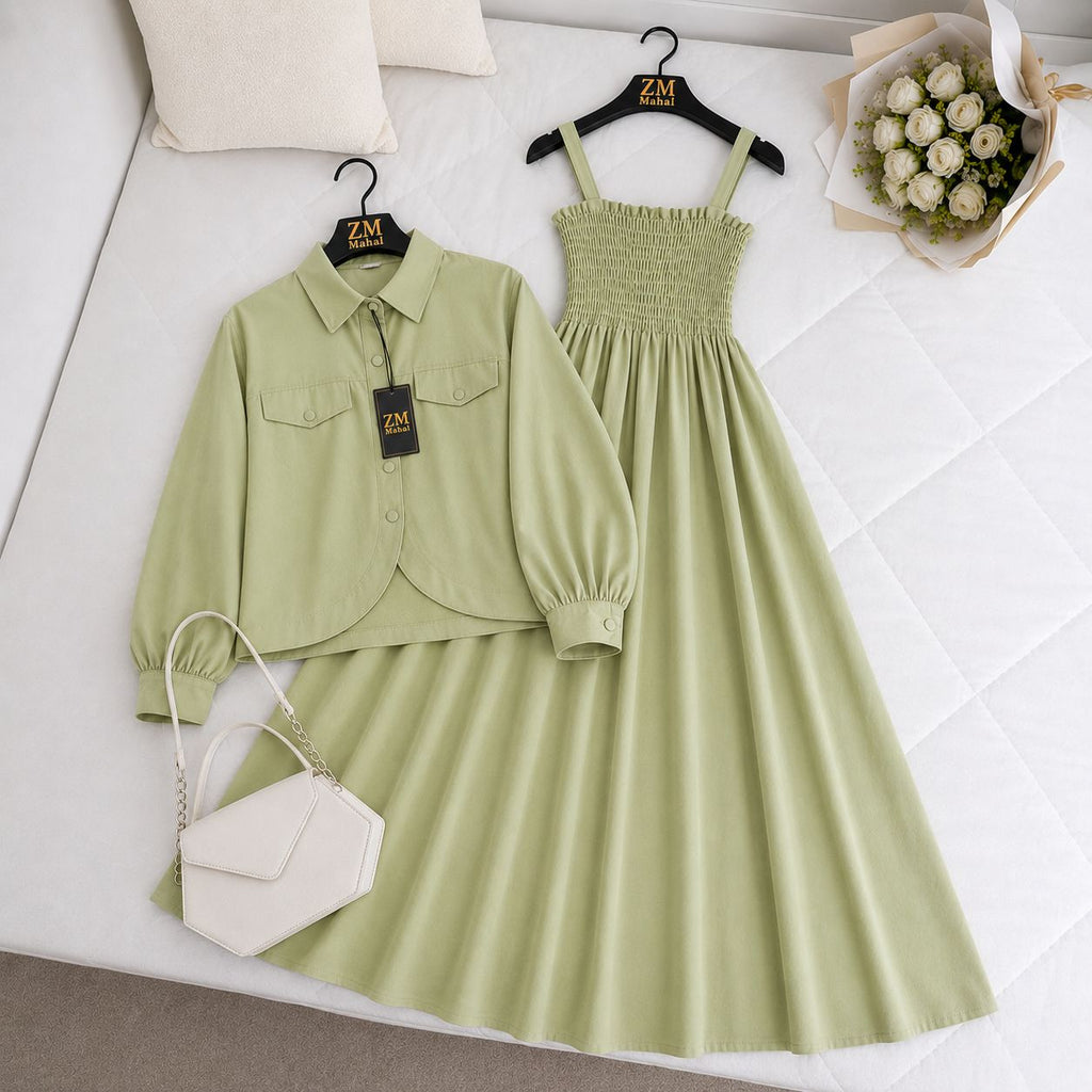 Green outfit with shirt, dress, and handbag on a white surface with 'ZM' branding.